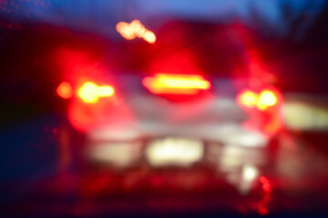 Wall Mural - light of car on road with accident in the night, blurred background in rainy day