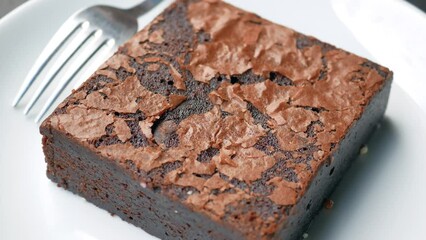 Wall Mural - slice of brownie on plate on table 