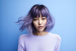 © Chari - Young Asian woman portrait in a lavender color background