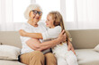 © SHOTPRIME STUDIO - Love woman grandmother sofa child couch happy girl home granddaughter family old