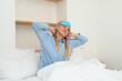 © Atlas - A young woman wearing a sleeping mask has just woken up