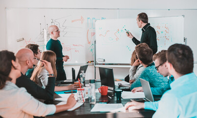 Wall Mural - Relaxed informal IT business startup company meeting. Team leaders discussing and brainstorming new approaches and ideas with colleagues. Startup business and entrepreneurship concept.