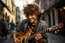 A Street Musician. A Young Man Plays Guitar On A City Street.