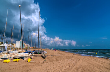 Canvas Print - Xeraco Spain boats on beach with sea and waves between Gandia and Cullera holiday destination