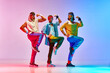 © master1305 - Men in vintage, colorful sportswear posing, doing aerobics exercises against against gradient pink blue background in neon light. Concept of sportive and active lifestyle, humor, retro style. Ad