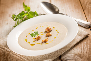 Wall Mural - artichoke cream soup with sliced bread