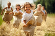 © eyetronic - Young children having fun at a sack race