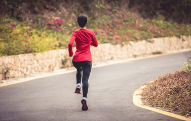 Poster - Asian woman jogging in park