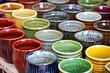 close-up of mugs with still-wet glaze