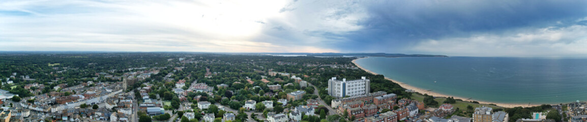 Aerial Panoramic View of British Tourist Attraction of Bournemouth Beach and Sea view City of England Great Britain UK. High Angle Image Captured with Drone's Camera During Hot Weather and Sunset.