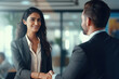 © Neha - Two Indian business man and woman shaking hands