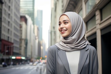 Sticker - Portrait of young muslim woman wearing hijab in the city