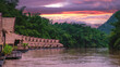 Tropical beach houses on the River Kwai in Thailand.Wooden floating raft house in river Kwai Kanchanaburi, Thailand at sunset