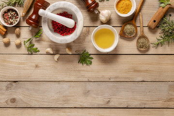 Poster - Asian menu concept. Healthy food cooking ingredients background with herbs, spices and olive oil on wooden table with copy space top view