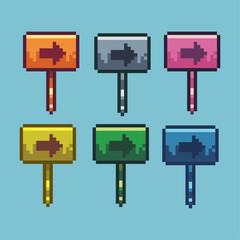 Fototapete - Pixel art sets of direction sign with variation color item asset. Simple bits of direct sign plank on pixelated style. 8bits perfect for game asset or design asset element for your game design asset.