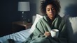 A young, ill woman holding a cup of hot tea in her hands while lying in bed. Generative AI