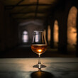 © tynza - Glass of cognac on the table in the cellar of traditional winery.