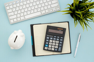 Wall Mural - Financial accounting analisis with calculator on office table, top view