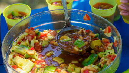 woman serving ceviche fresh aperitive summertime latin american food in a bowl outdoors