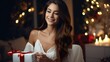 © Ilnaz Gilov - Smiling cute girl holding a gift box in the living room for Christmas