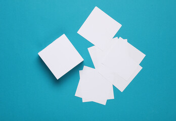 Wall Mural - White square memo papers on a blue background