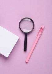 Poster - White square memo papers with a magnifying glass and pen on puerple pastel background