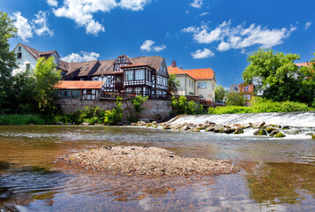 Wall Mural - Old half-timbered houses on the banks of a canal in Marburg.