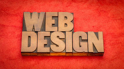 Wall Mural - web design word abstract in vintage letterpress wood type against textured handmade paper, internet 