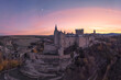© ADDICTIVE STOCK - Drone view of medieval castle against sunset sky and moon