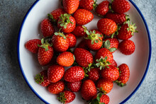 Organic Strawberries In A White And Blue Plate.