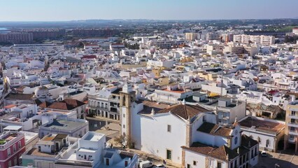 Canvas Print - Aerial drone footage of the Portuguese southern town of Olhao. flight to the foot of the Nossa Senhor dos Aflitos Chapel Church