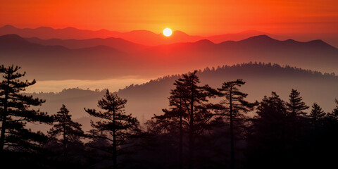 Canvas Print - sundown over mountain range, fiery orange and red sky, silhouettes of pine trees, wisps of fog, tele
