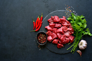 Poster - Raw organic meat ( beef or lamb ) . Top view with copy space.