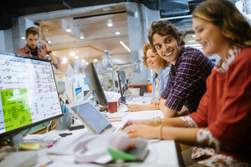 Wall Mural - Diverse group of people working in a modern computer office