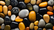 pebble background close up - amber, grey and black stones