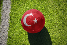 Football Ball With The Flag Of Turkey On The Green Field Near The White Line