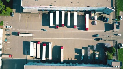 Wall Mural - Warehouse storages or industrial factory or logistics center from above. Aerial view of industrial buildings and equipment machines. Aerial view