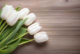 Fototapeta Tulipany - White tulips on wood table.