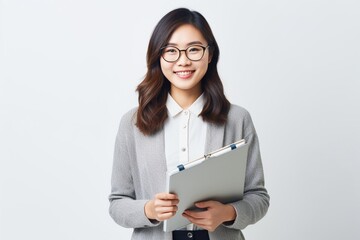 Generative AI : Image of young asian woman, company worker in glasses, smiling and holding digital tablet, standing over white background