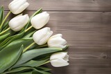 Fototapeta Tulipany - White tulips on wood table.