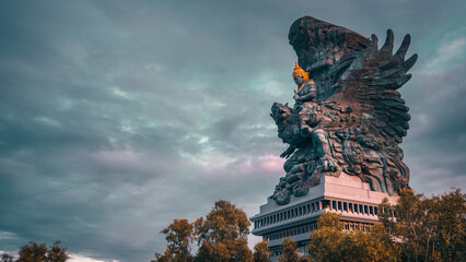 Wall Mural - Bali's Most Iconic Landmark Hindu God Garuda Wisnu Kencana statue also GWK statue is a 122-meter tall statue located in Garuda Wisnu Kencana Cultural Park, Bali, Indonesia.