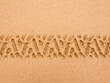 © Austockphoto - Tyre tread pattern in beach sand