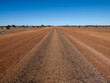 © Austockphoto - Straight single laned sealed road disappearing in the distance