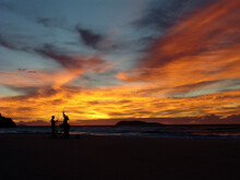 Fishermen Silhouetted Against Yellow/orange Sunset Nelsons Bay