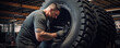 © Michal - Mechanic repairing a large tire. grenerative ai