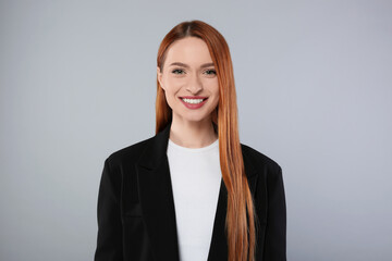 Poster - Portrait of beautiful young woman on light gray background