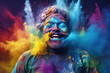 Happy young Indian man celebrating Holi festival with splash of colors