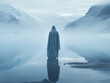 Solitary figure standing by serene icy lake amidst mountains. Winter Solstice and Pagan Christmas concept. Design for meditation poster, print, wallpapers with place for text