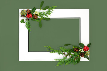 Wall Mural - Festive Christmas winter flora with holly mistletoe ivy and cedar on green background with white frame. Holiday border design for greeting card, logo, invitation, label, gift tag.