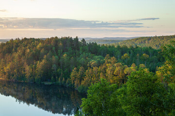 Wall Mural - trees on hills at dawn by a lake near the gunflint trail in northern minnesota during summer